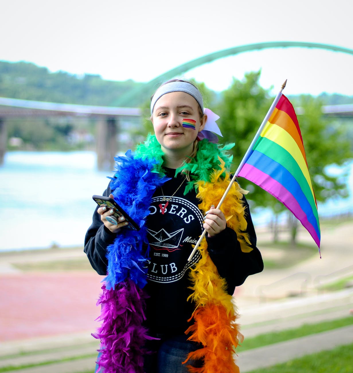 person holding lgbt flag